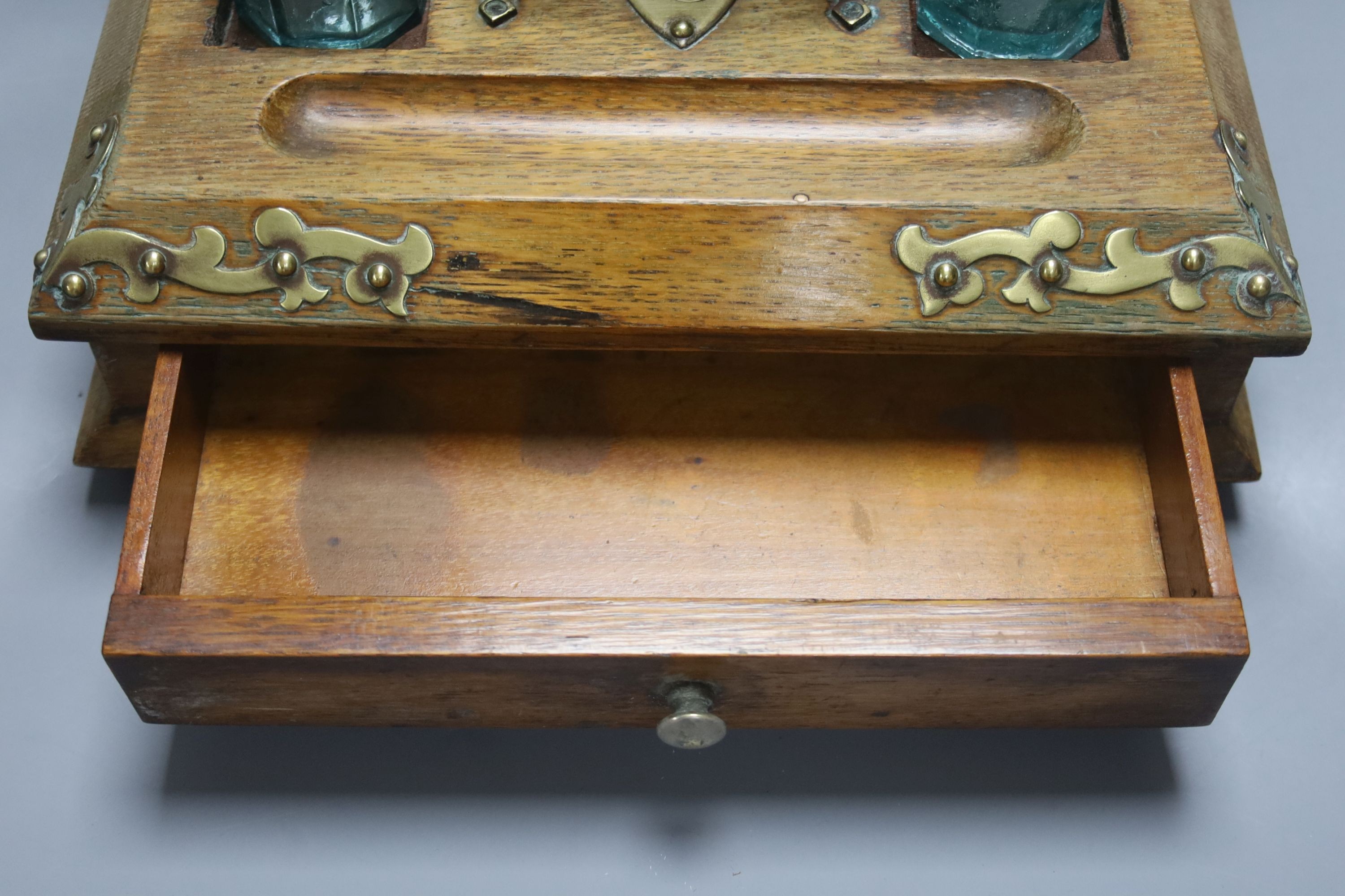 An Edwardian oak stationery box and an oak inkstand